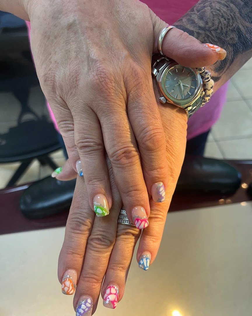 Freshly finished nails beside a nail lamp.